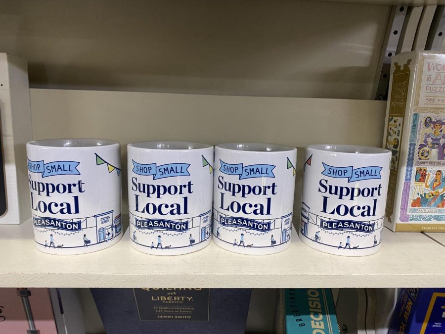 Towne Center Books is selling coffee mugs advertising the Shop Small event, a way to boost small businesses in the area while offering decorative merchandise to fill their shelves.