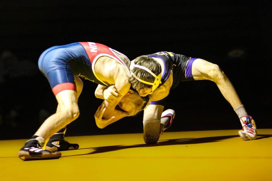 Michael Wisoff ('24) uses all his strength to get his opponent on his back.
