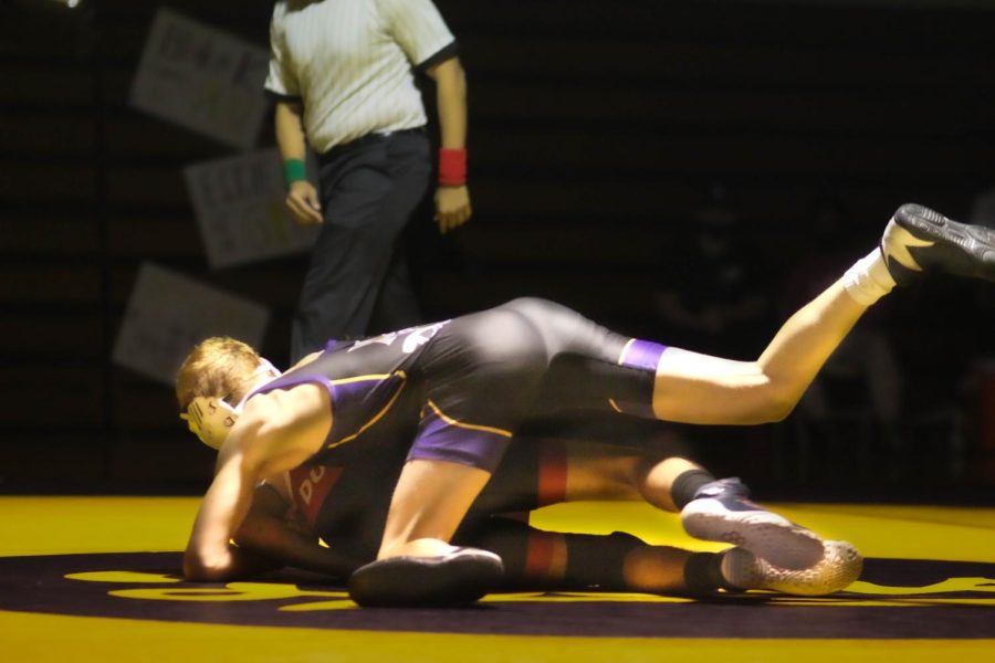 Luca Moore '25 takes the upper-hand in his match.