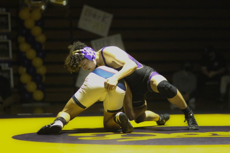 Ryan Rodriguez (24) struggles to win his match.