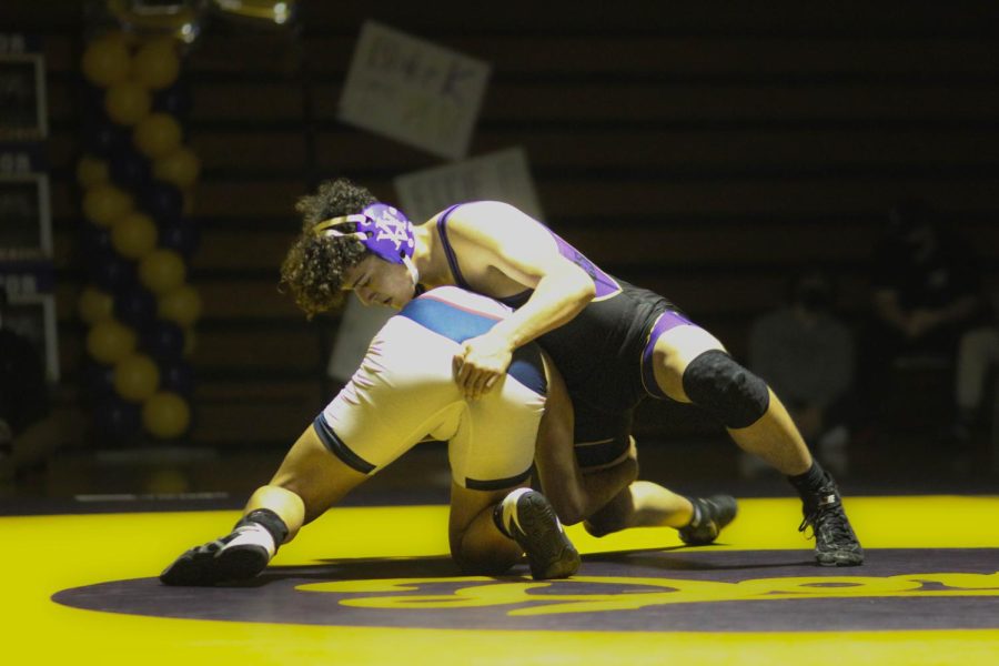 Ryan Rodriguez ('24) struggles to win his match.