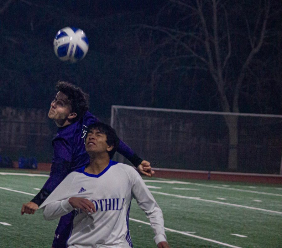 Jan Schullerus (23) headbutts the ball in midair before Foothill.
