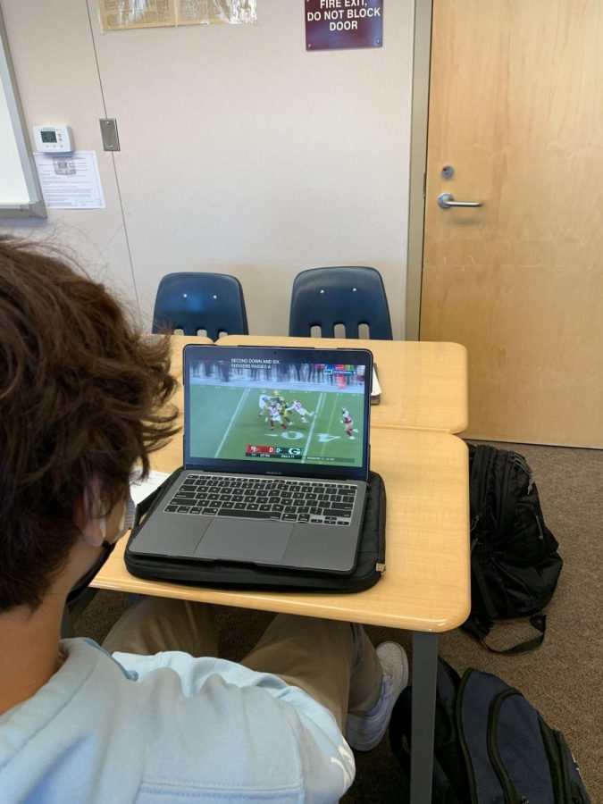 Jalen Alami (‘24) watches football highlights to get excited for the final games of the NFL playoffs!