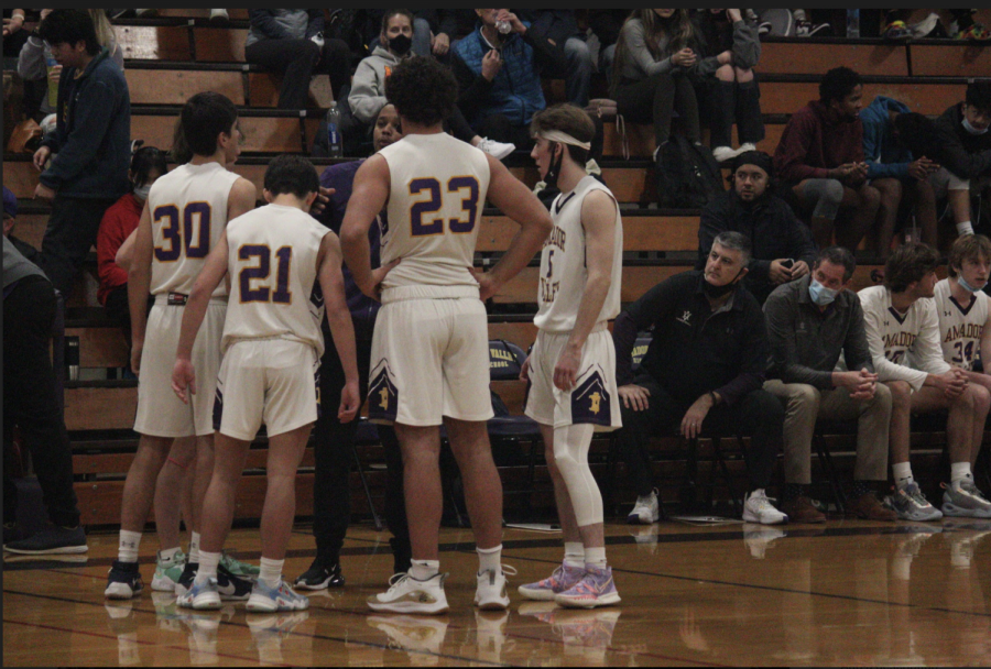 Abe Tabatabian ('22), Tyler Cheng ('22), Brady Nassar ('22), and Foster Keast ('22) planning their next move on the court.