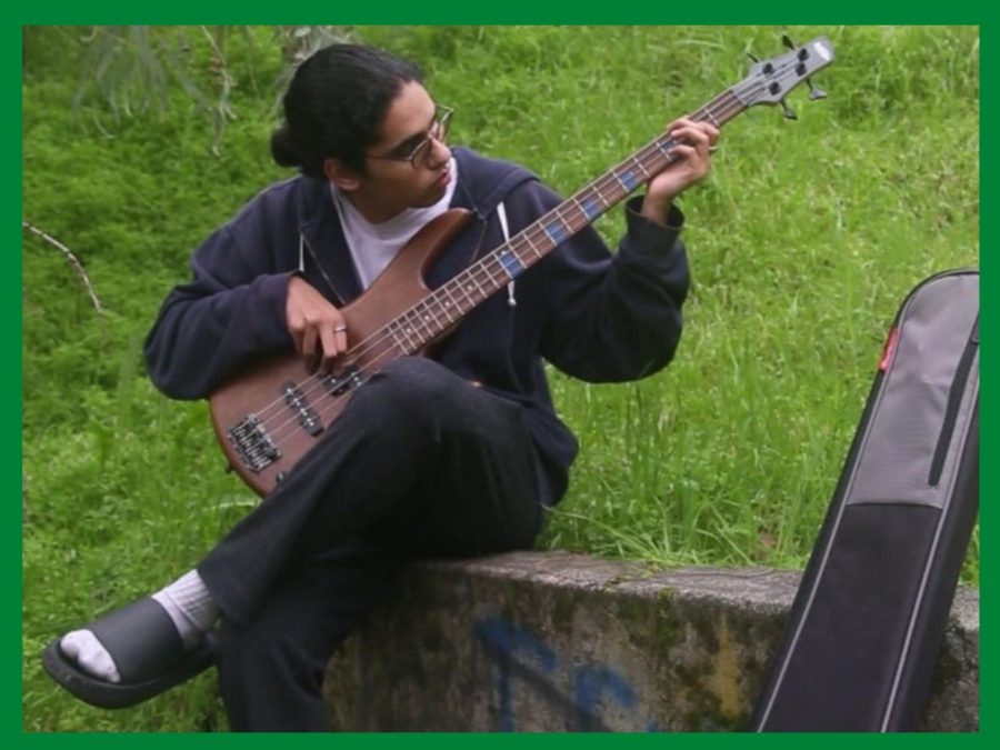 Nagaraj strums a chord on his guitar to experiment with new sounds.