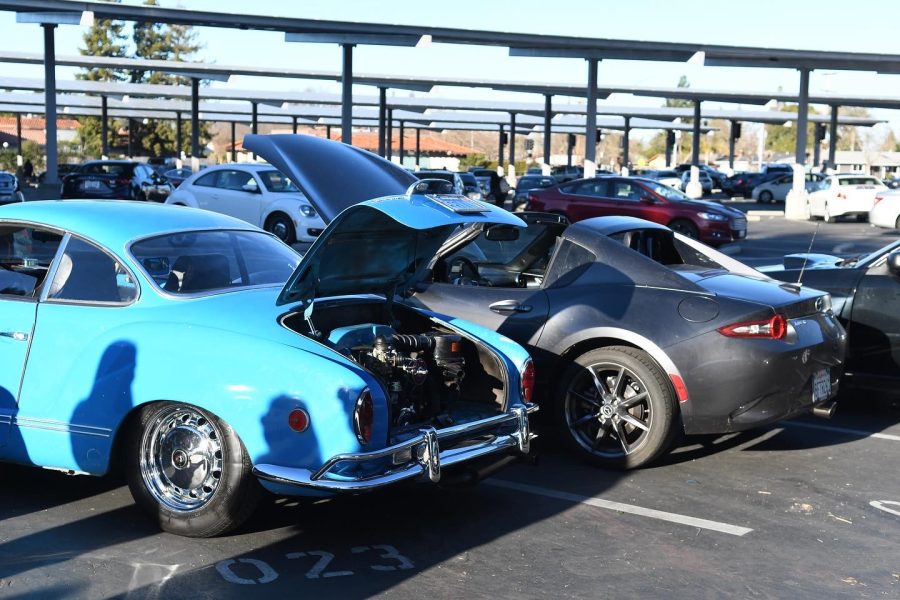 Students popped the hood of their cars open to show the layout of their engines.