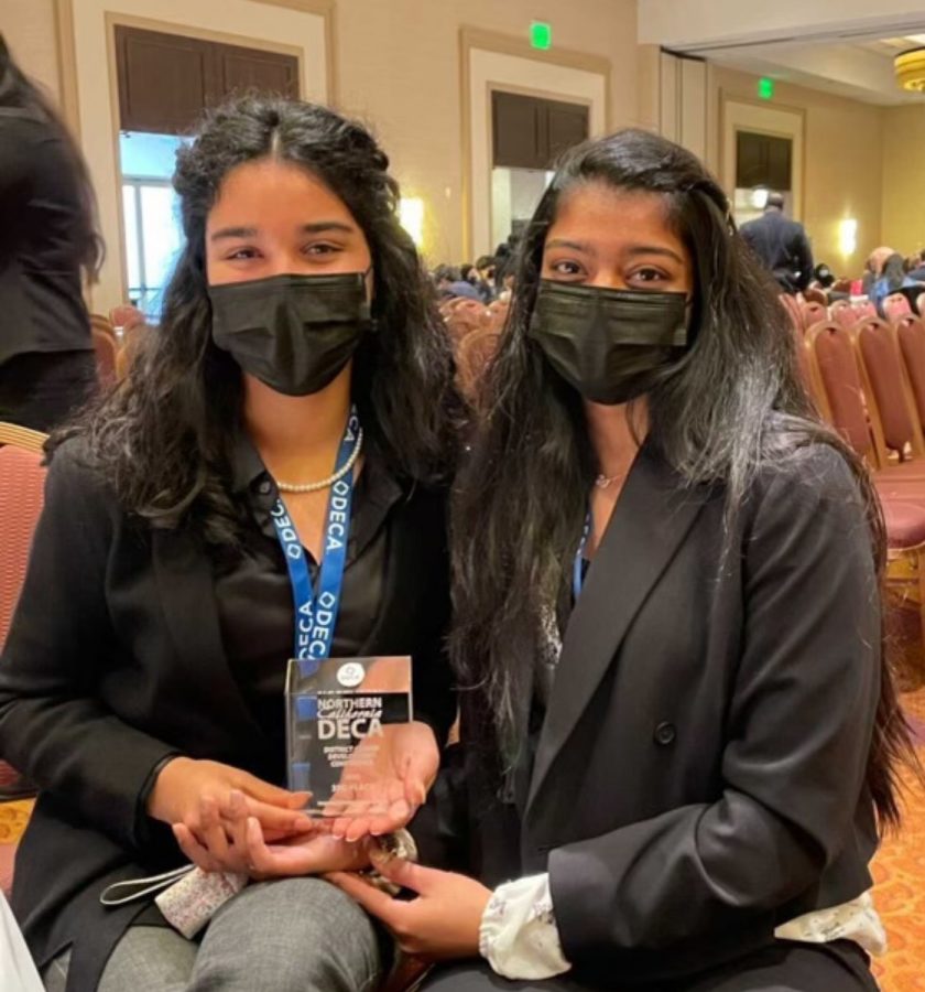 Anisha Madiraju and Samaira Mehta holds their glass award as 3rd overall from the IMCP (Integrated Marketing Campaign) event.