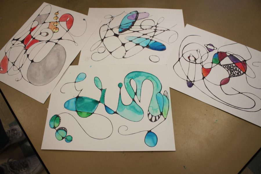 Art 1 students create freestyle drawings using their names connecting it together with neuropathways. 