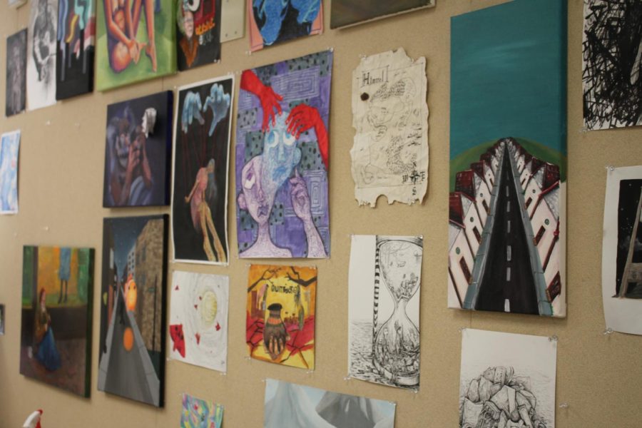 A collage of AP Art student’s artwork hangs on the wall of Micheal Doyle’s (AV Art Teacher) classroom. 