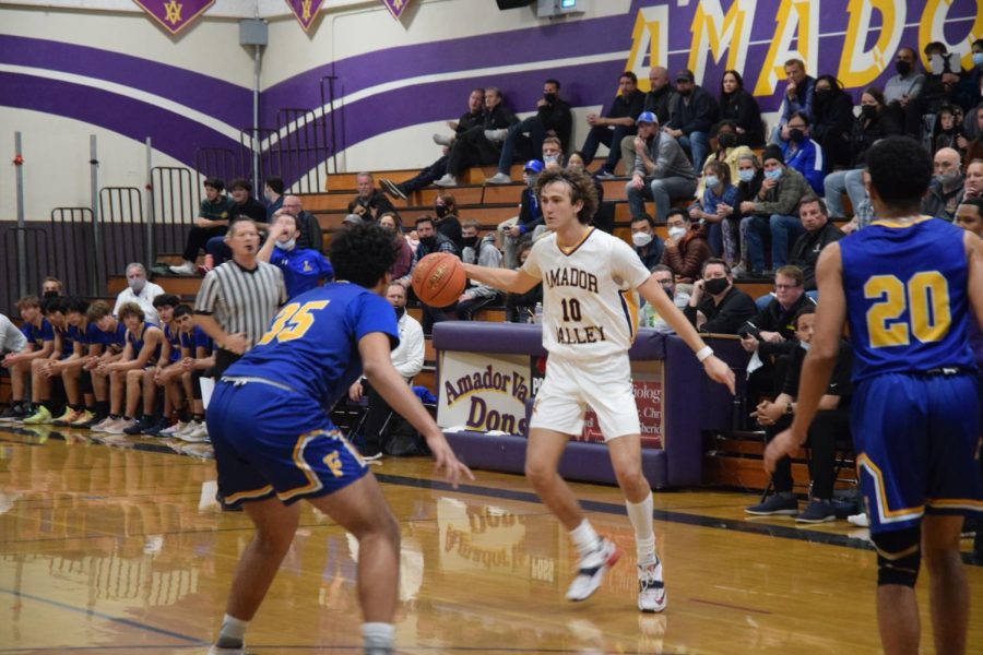 Colin Wallace (22) is surrounded by Foothill players, demonstrating that even the best players on the team struggled to get past Foothills practiced defense.