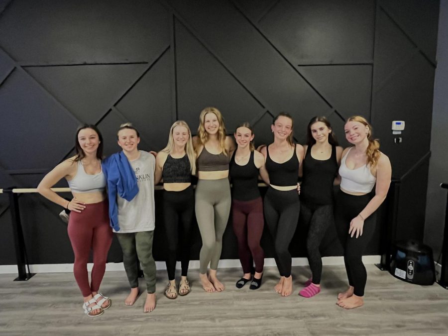 Amador students after a heated yoga class pose with smiles and tired but fit bodies.