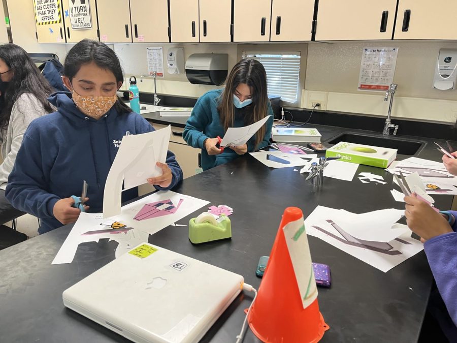 The club met in a science room to put the models together.