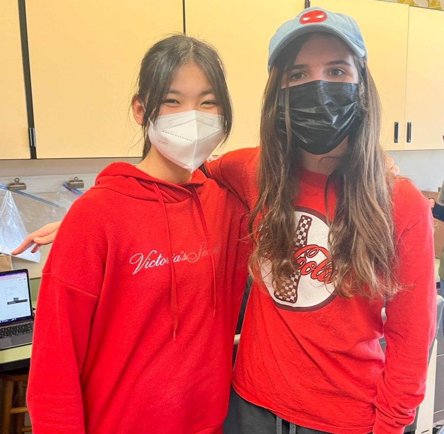 Carol Xu ('23) and Katy Clark ('24) deck out in red on Staff Love Day.