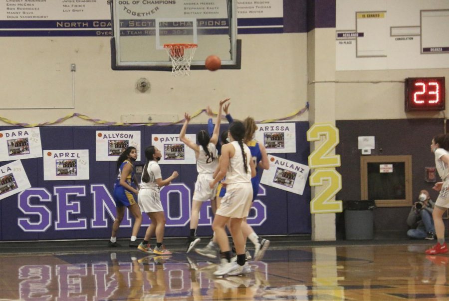 Ally Chan ('22) tries to make the goal while surrounded by rivals.