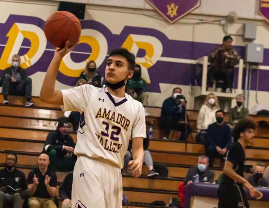 Ethan Daley ('22) catches the basketball after halftime as the players return to the court.
