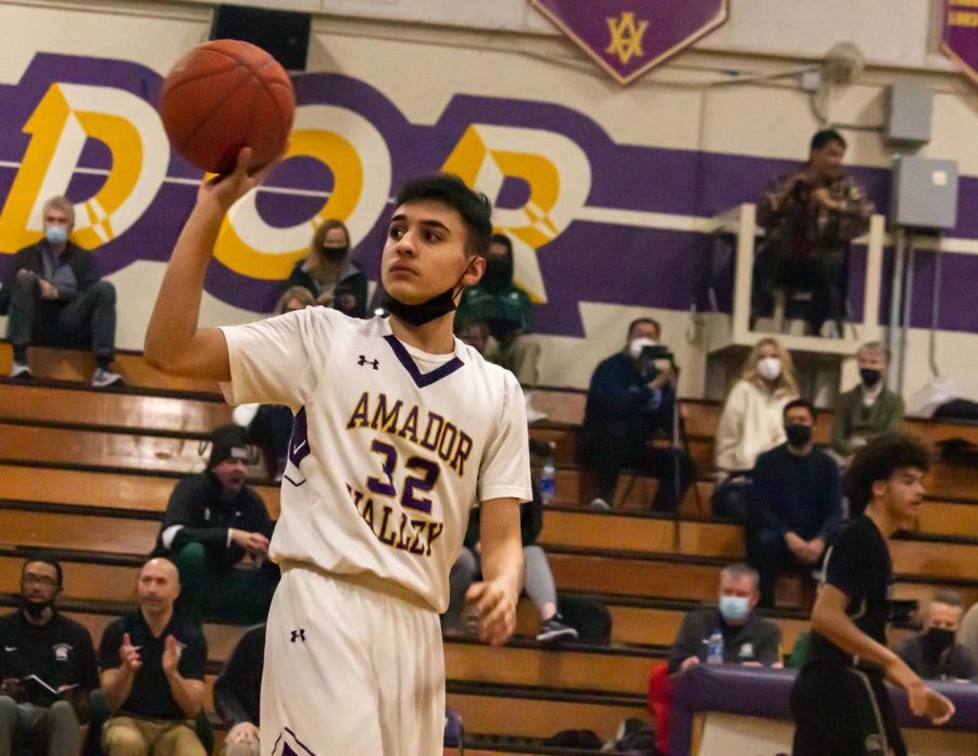 Ethan Daley (22) catches the basketball after halftime as the players return to the court.