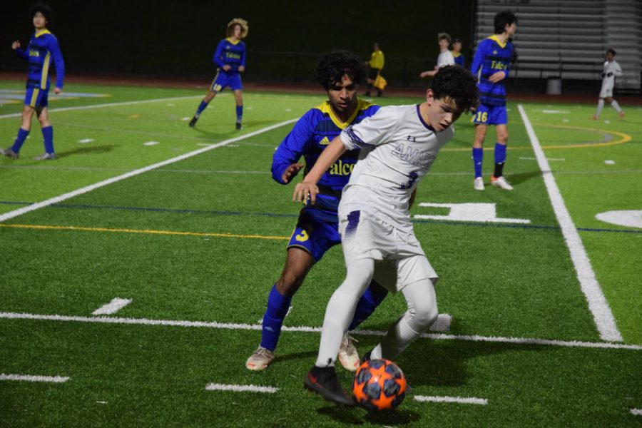 Kyle Larsen #3 protects the ball from a Foothill defender as they fight for the ball.