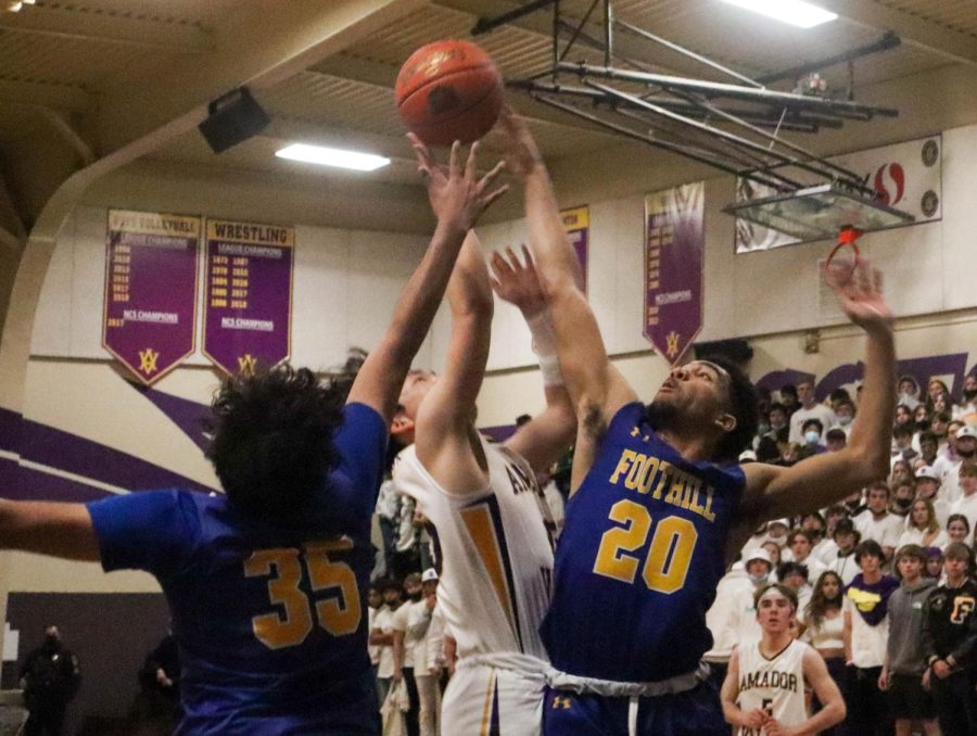 A heated confrontation on the paint between Bryce Osaki and two Foothill players.