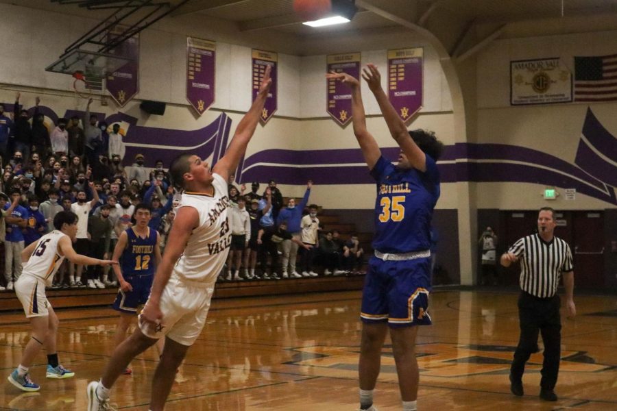 Brady Nassar (21) attempting to block a shot from Foothill.