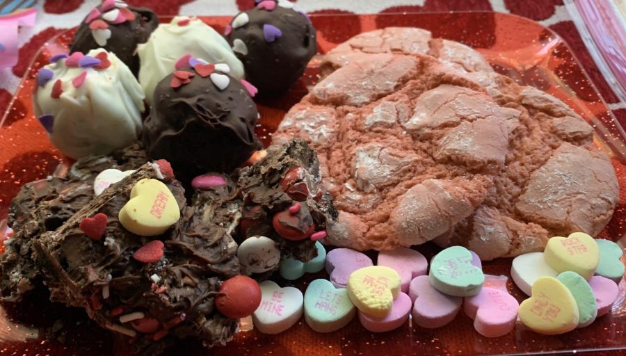 Try these three cute Valentines Day treats: pink crinkle cookies, Valentine’s cookie bark, and red velvet truffles.