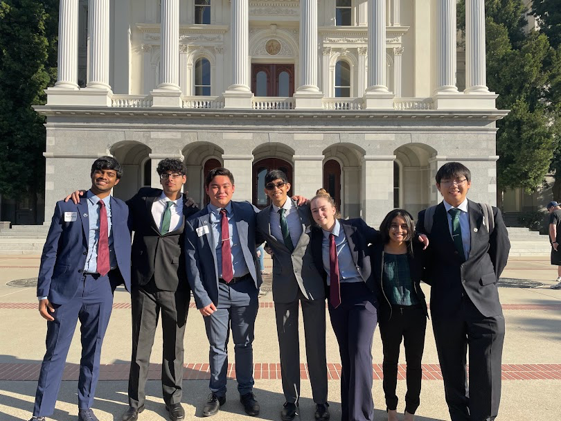From Left to Right: Akash Madiraju (22), Jaiteg Chahal (22), Tom li (22), Om Khangoankar (22), Soraia Bohner (22), Sanika Newadkar (22), and Edward Ding (22) gather in front of the state capital. Their units worked closely together over the past months and hoped to see their hard work pay off.