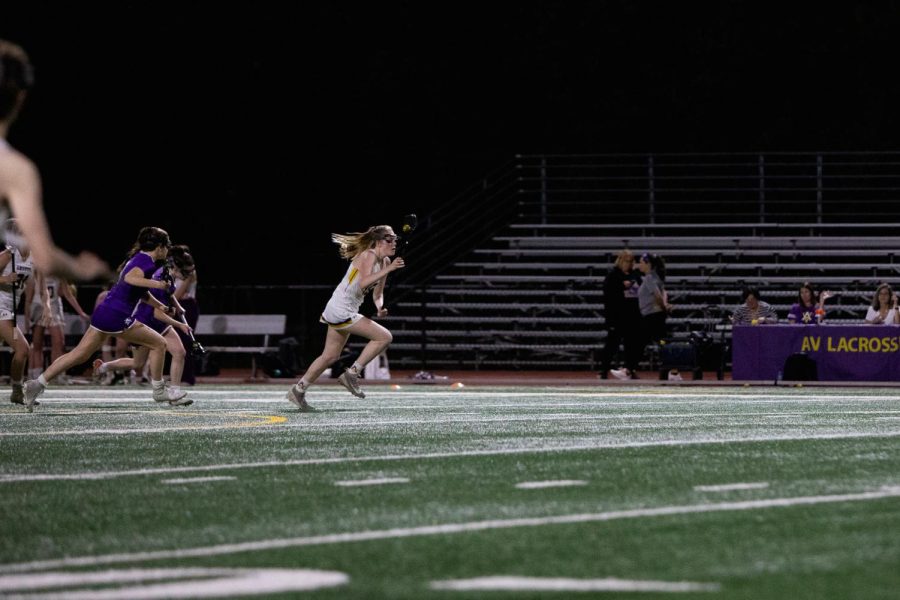 Sophia Marcoux ‘23 starts the offense by running downfield with the ball.