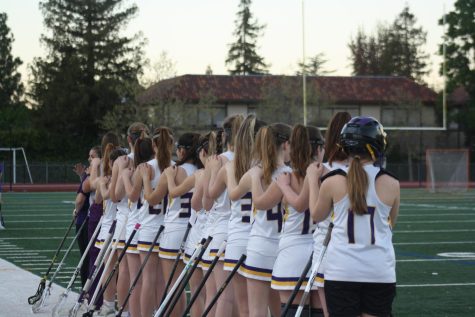 Amador lines up, facing the flag for the National Anthem.