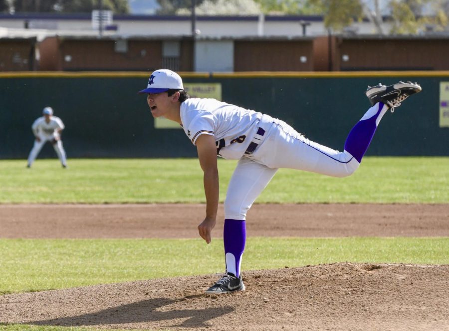 Tyler Kubo ('23) pitches the ball with a fast speed.