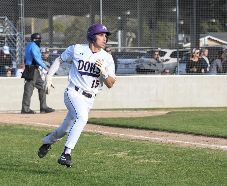 Braden Whitworth ('23) runs toward the first base.
