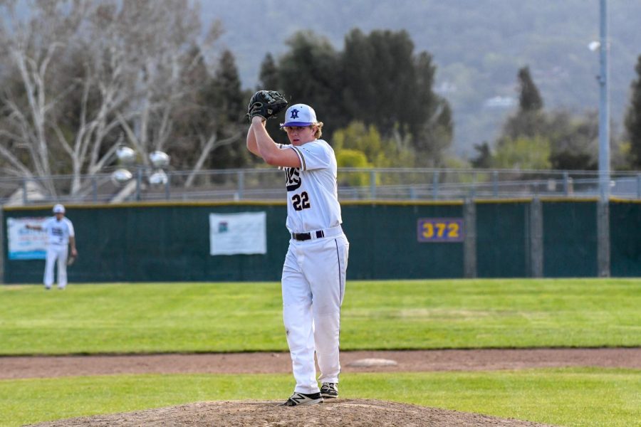Brady Lederer ('23) puts his arm up and gets ready to pitch the ball.