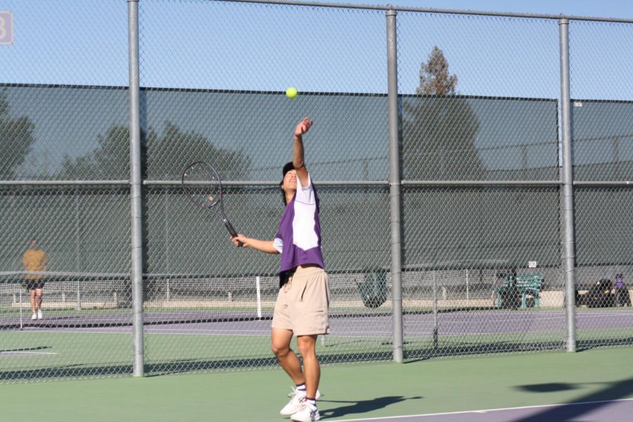 Bryan Park (23) focuses intensively while doing his first serve.