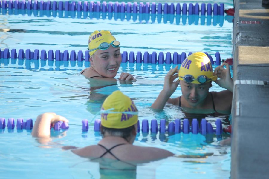 Amador laughed and joked together as they warmed up for the upcoming women's relay.