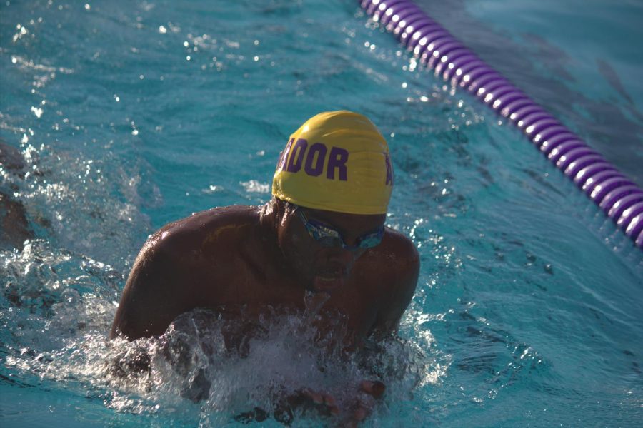 An Amador swimmer prepares to finish his final lap of the 100 yard breaststroke.