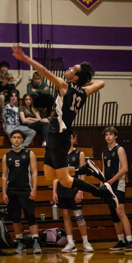 Max Riter (25) prepares to serve the ball.