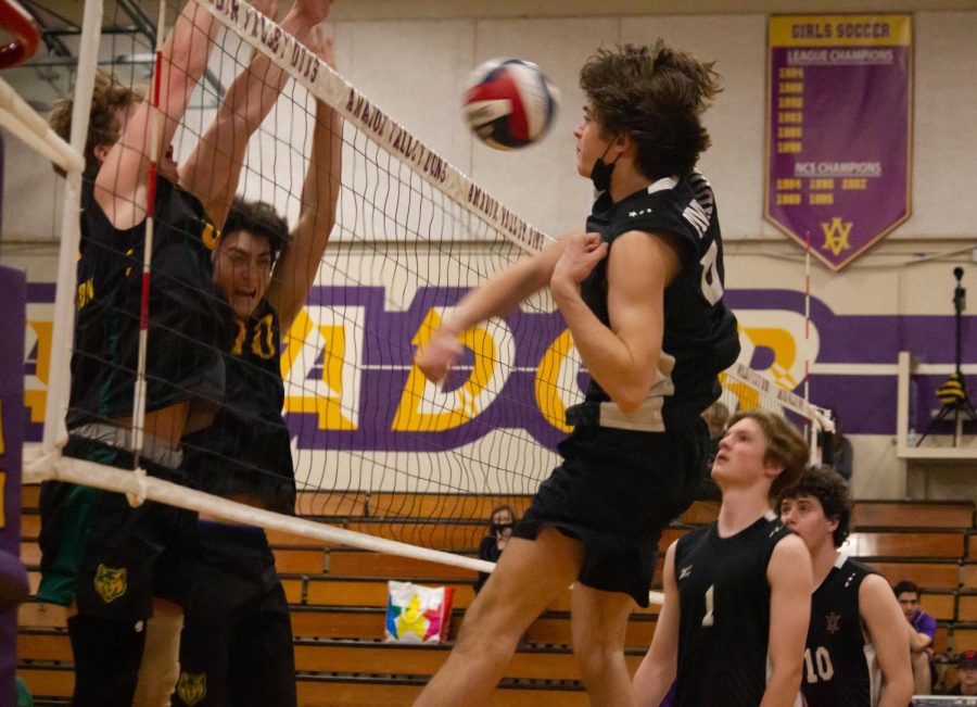 Luke Melvin (23) attacks against two blocking SRV players.