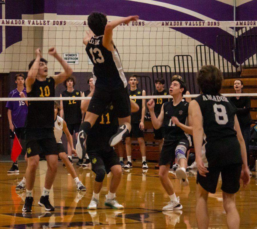 Nate Clinton ('23) drives the ball downward, scoring a point for Amador.