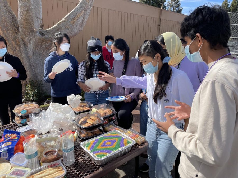 French students brought cakes and a variety of desserts as they celebrated Mardi Gras together outsid eof the classroom.