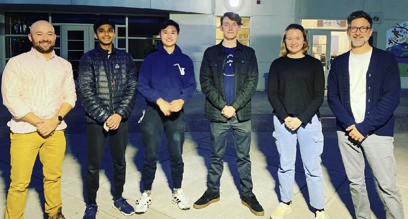 The full drum major team, from left to right: Mr. Edwin Cordoba, Vardaan Singhania ('25), Brayden Ye ('24), Nolan Lees ('23), Julia Szambelan ('22), and Mr. Jonathan Grantham.