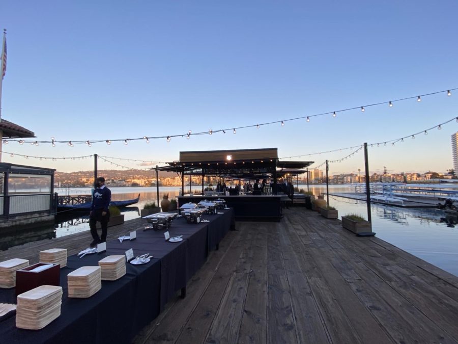 A buffet—including chicken tenders, grilled cheese, fruits, and cupcakes—was set up on the docks.