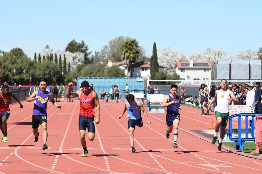 Thomas Kim (23) and Bryce Osaki (22) stride to the finish line.