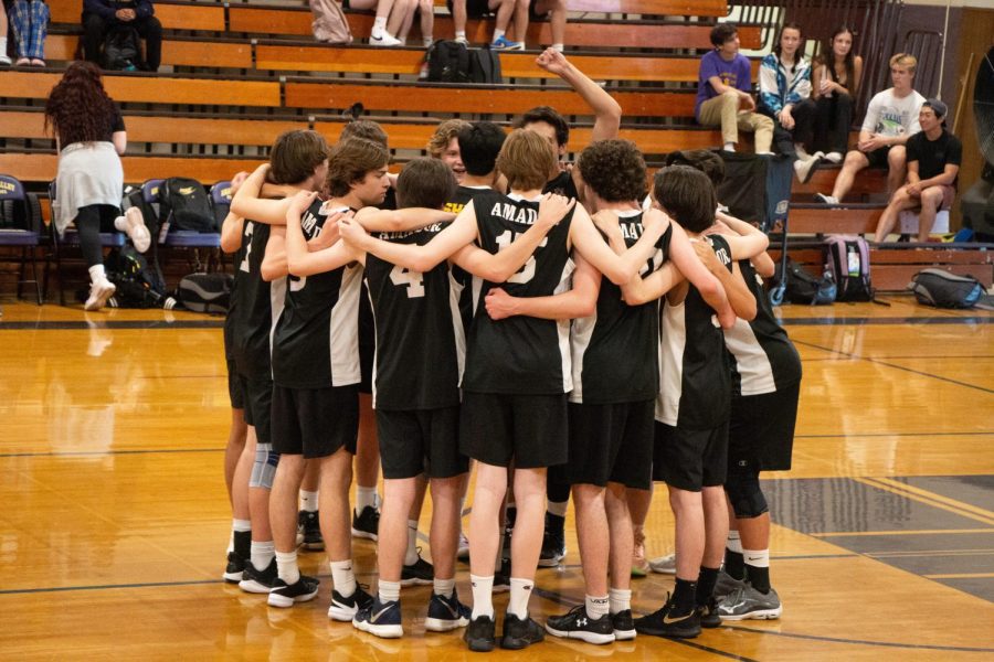 The Amador team rallies together after losing the second set of the game 15-25.