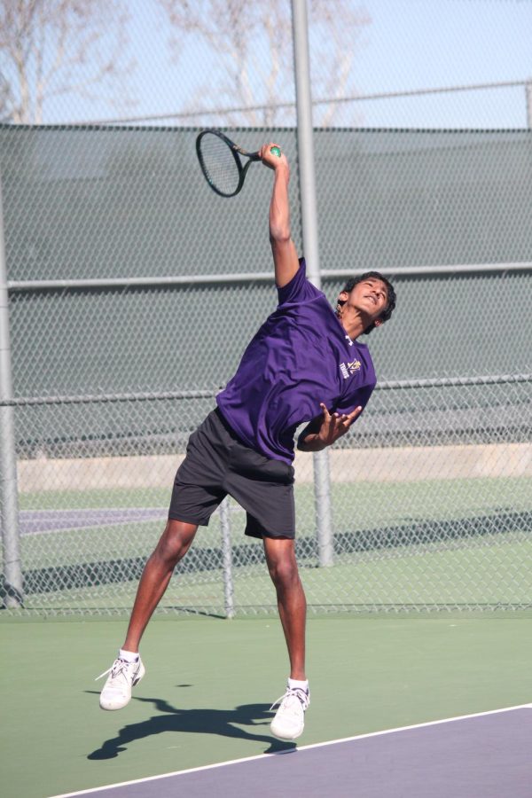 Hrishi Hari (22) reaches to receive the tennis ball.