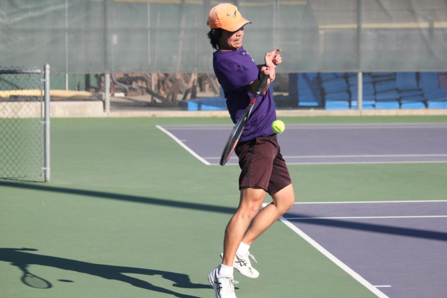 Bryan Park ('23) clenches his teeth as he continues the rally.
