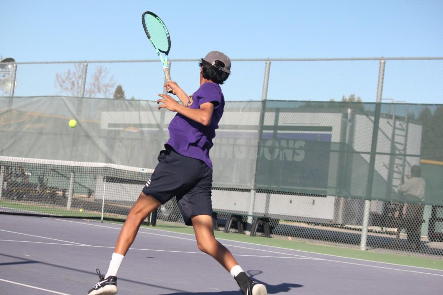 Rohan Patil ('25) prepares to send the ball over the net.