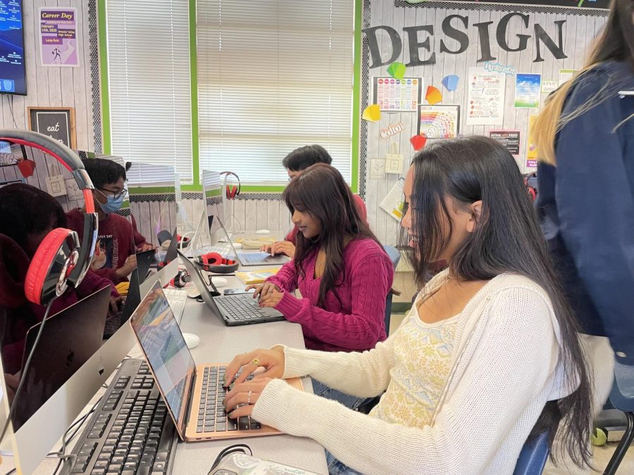  Ritika Ghosh (‘23) and Julianna Diwa (‘24) working together with no masks.