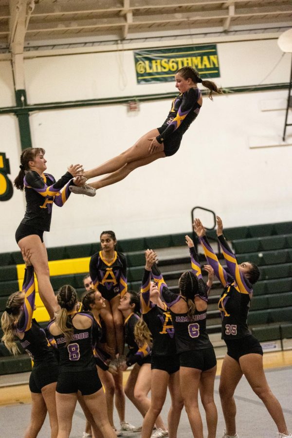 Samantha+Richert%2822%29+throws+Kate+Dooley%2824%29+up+into+the+air+during+their+stunt+game+against+California+High+School.