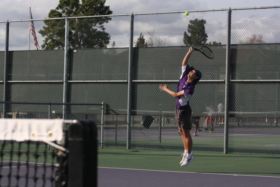 Bryan Park (23) jumps high in the air to serve in his first round of the day.