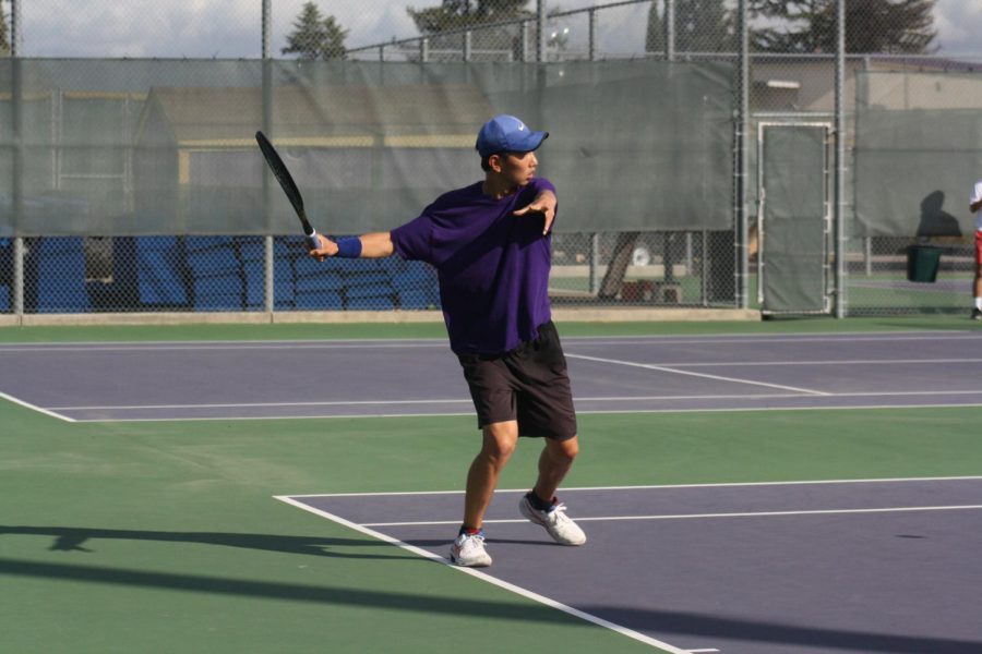 Minsung Kim ('25) backswings to catch his opponent's serve.