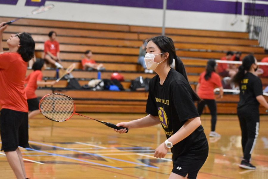 Sanami Kanda (25) gets ready to receive her opponents serve. Kanda swiftly won her match, 21-4 and 21-3.