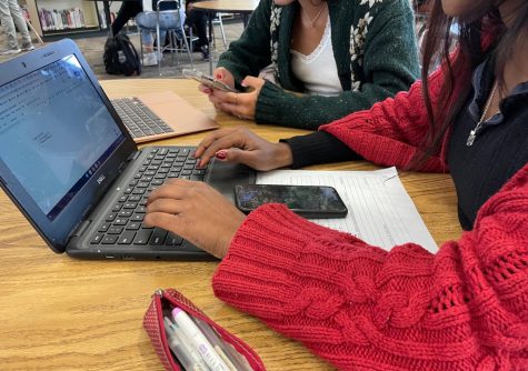 Ritika Ghosh (‘23) and Julianna Diwa (‘24) both work on a project while using their computers and phones. They have no idea how much bacteria is lying on the surface of their electronics. 